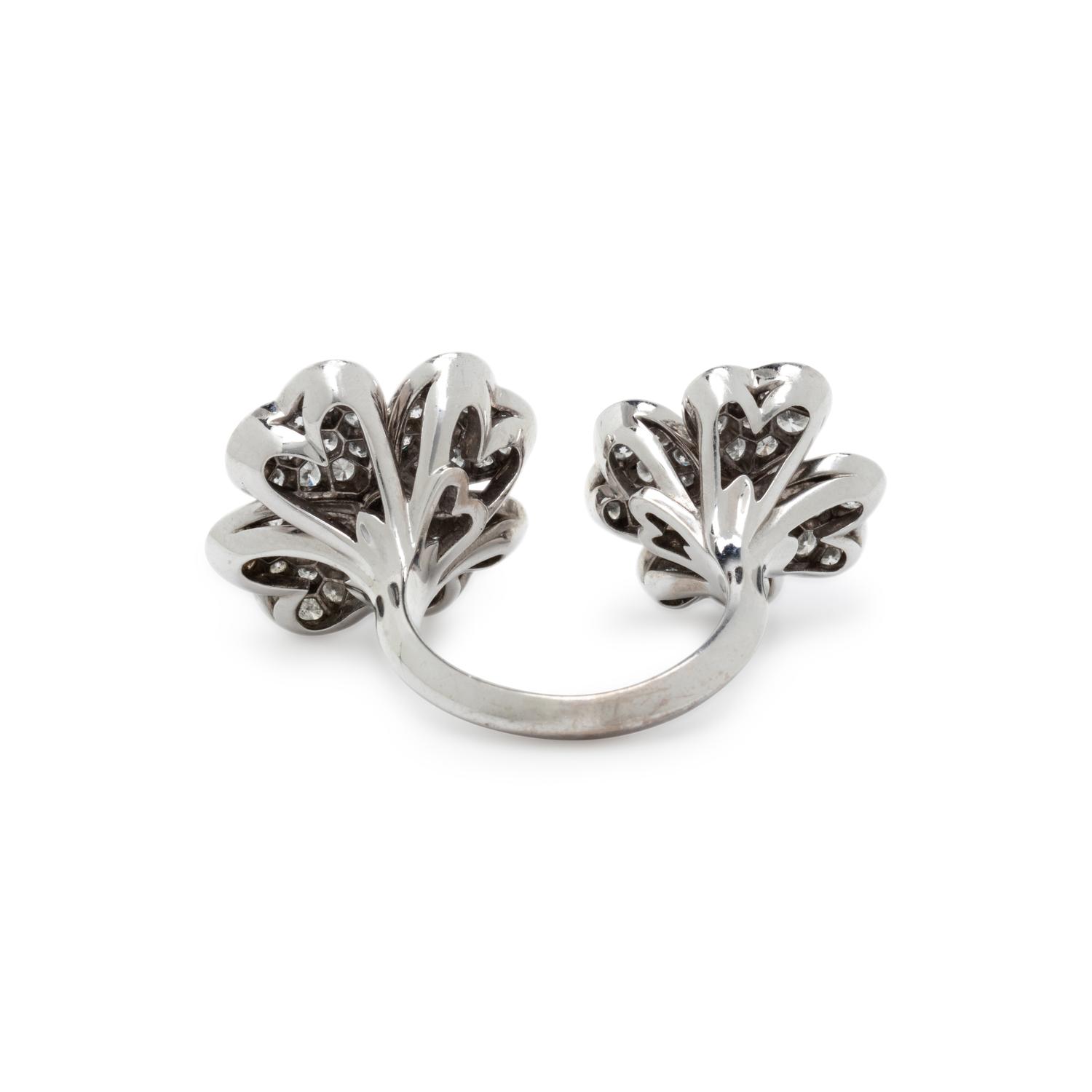 VAN CLEEF & ARPELS, DIAMOND AND WHITE GOLD 'COSMOS BETWEEN THE FINGER' RING