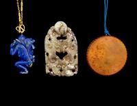 Three Chinese Jade and Hardstone Pendants