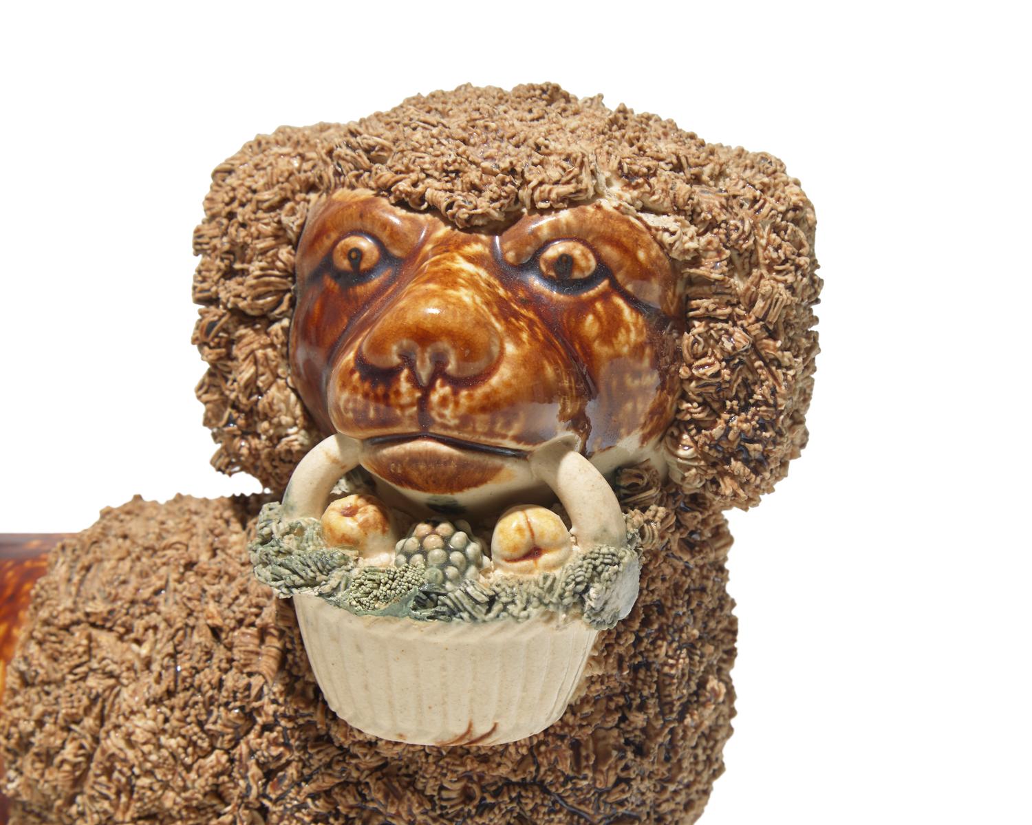 A Bennington Glazed Spaniel with Basket