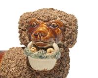 A Bennington Glazed Spaniel with Basket
