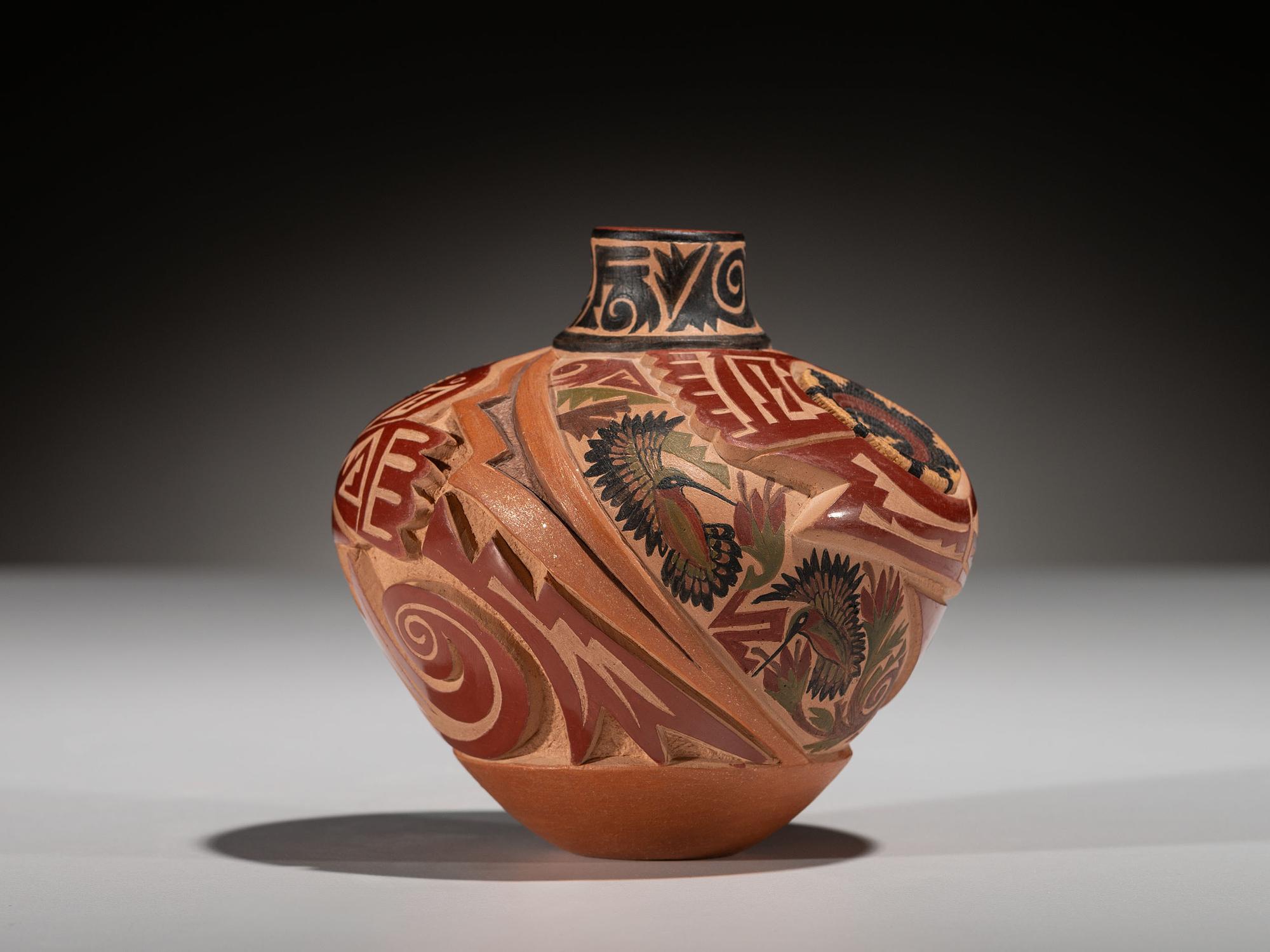 Carved Polychrome Pottery Vase