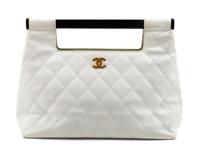 A Chanel White Caviar Quilted Melrose Cabas Wood Handle Bag, 10.5" H x 13.5" W x 4.5" D; Handle drop: 2".