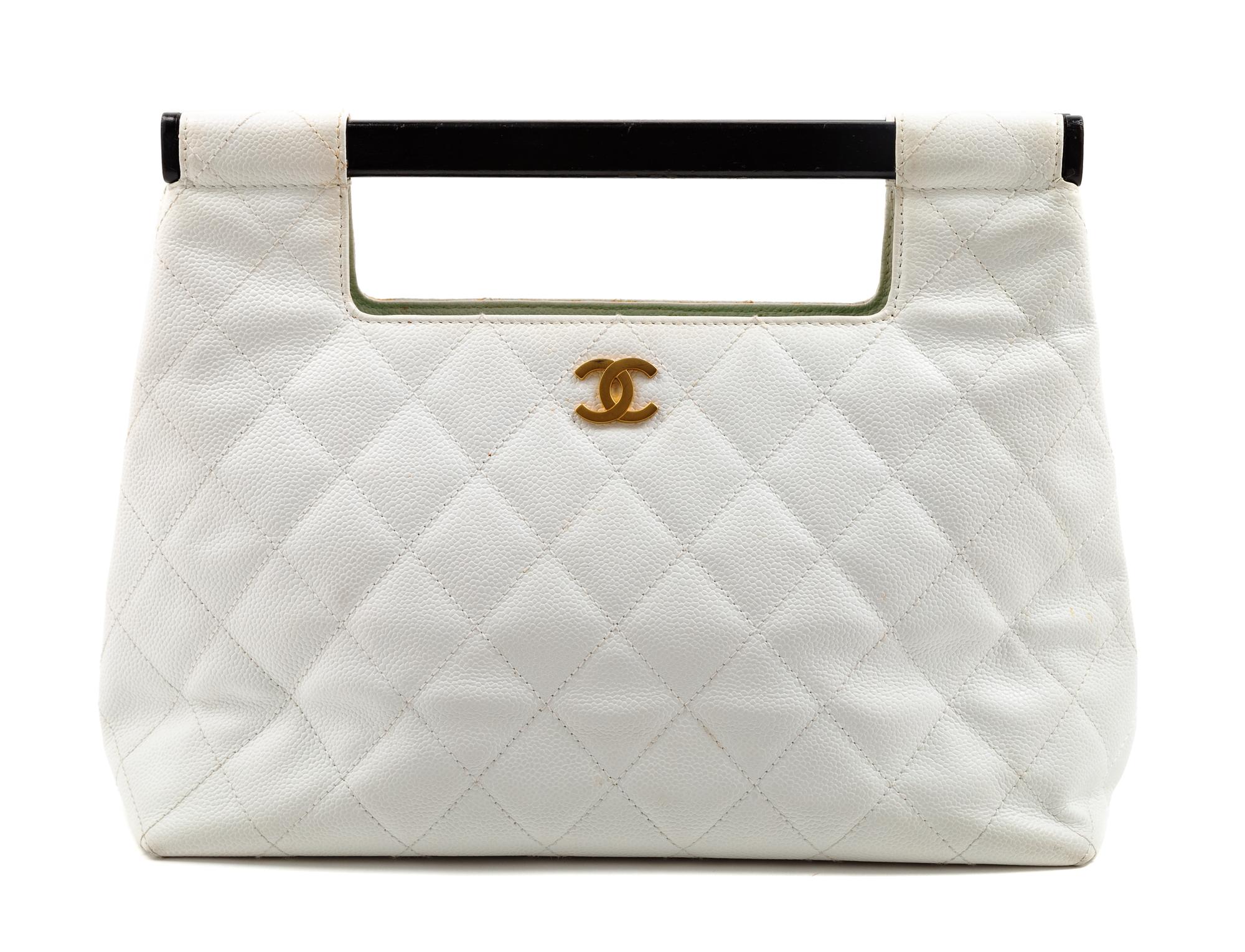 A Chanel White Caviar Quilted Melrose Cabas Wood Handle Bag, 10.5" H x 13.5" W x 4.5" D; Handle drop: 2".