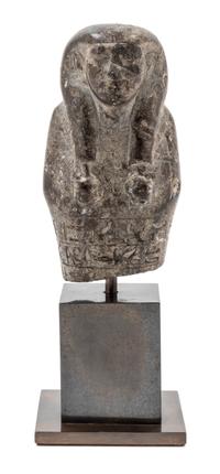An Egyptian Stone Ushabti of Wedjarenes — 25TH/26TH DYNASTY, CIRCA 680-620 B.C.E.