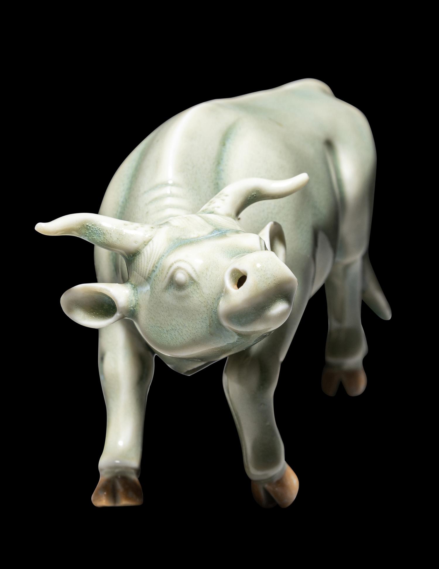 A Japanese Hirado Celadon Glazed Porcelain Water Buffalo-Form Water Dropper