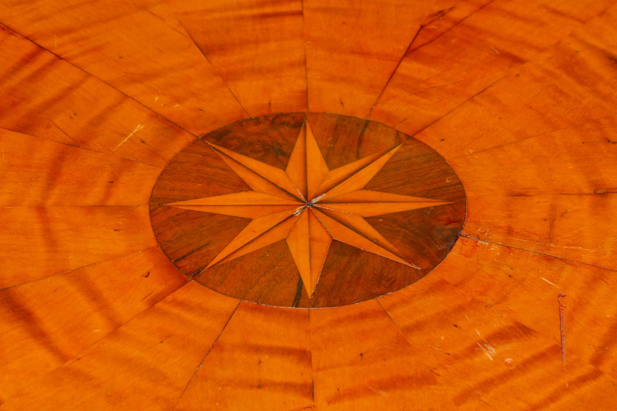 An Austrian Part Ebonized and Inlaid Ash and Walnut Center Table — 19TH CENTURY