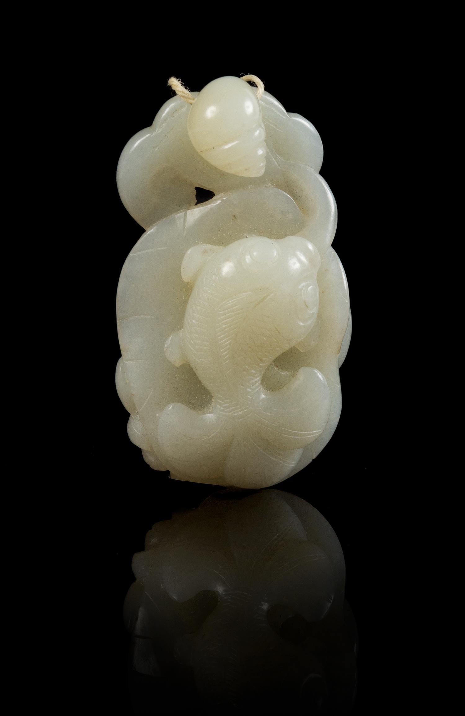 A Carved Jade Toggle Length 2 1/4 inches.