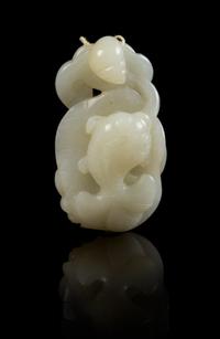 A Carved Jade Toggle Length 2 1/4 inches.