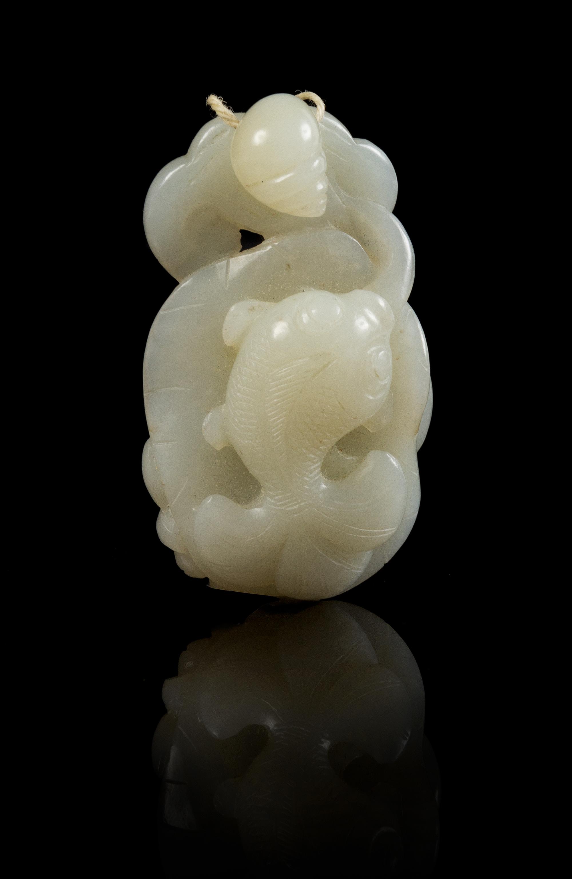 A Carved Jade Toggle Length 2 1/4 inches.