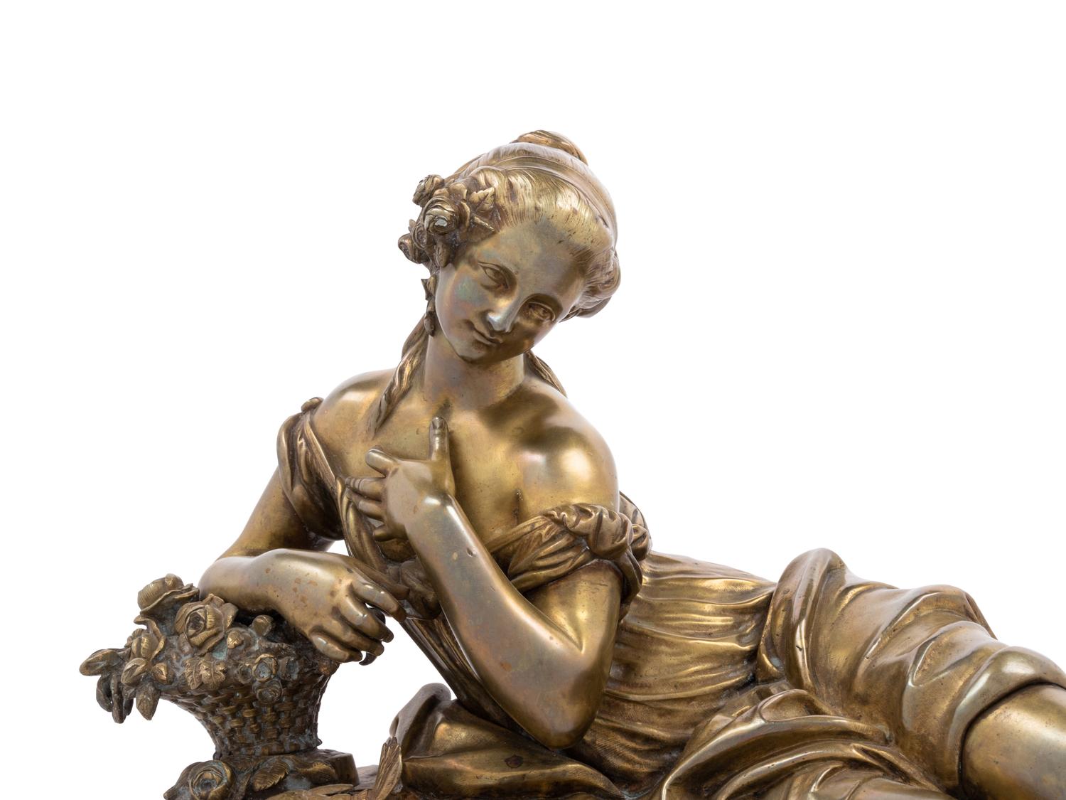 A Gilt Bronze Figure of a Reclining Woman