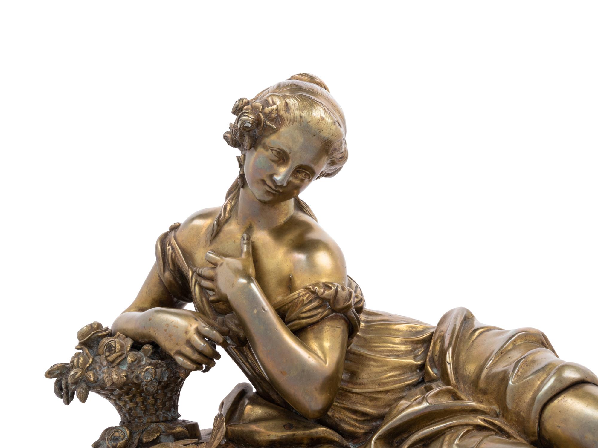 A Gilt Bronze Figure of a Reclining Woman