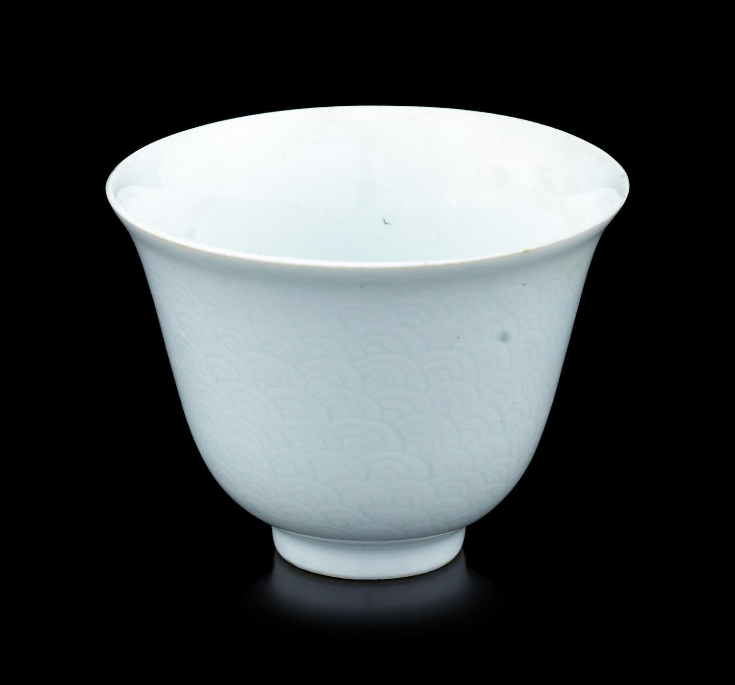 A Chinese Incised White Glazed Porcelain 'Waves' Cup