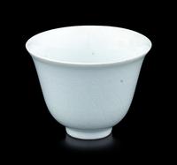 A Chinese Incised White Glazed Porcelain 'Waves' Cup