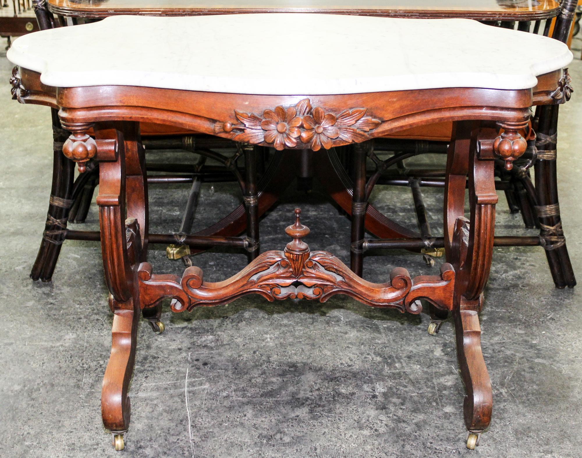 A Victorian Walnut Occasional Table Height 29 inches.