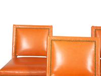 A Set of Five Contemporary Carved Oak and Leather Bar Stools