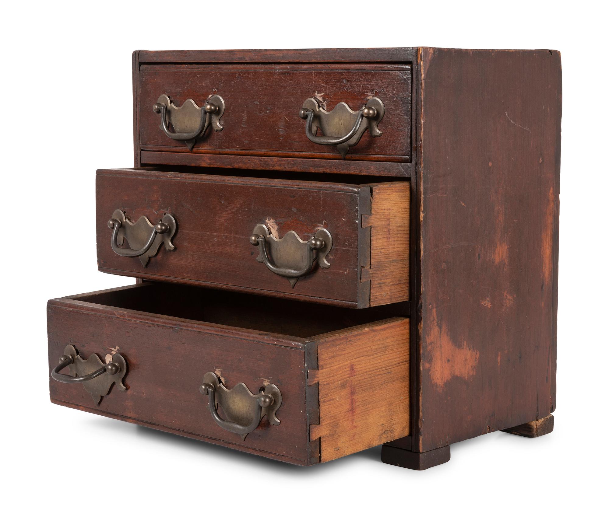 A Stained Pine Miniature Chest of Drawers