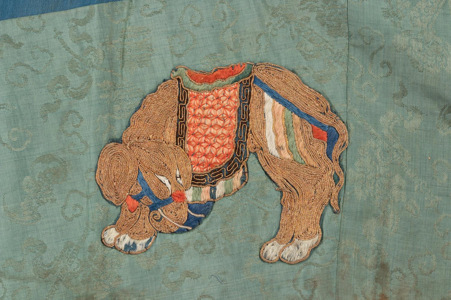 Two Chinese Blue Ground Silk Robes, Late Qing Dynasty 清晚期 藍地盤金繡游龍瑞獸纹道袍及藍地織錦女褂
