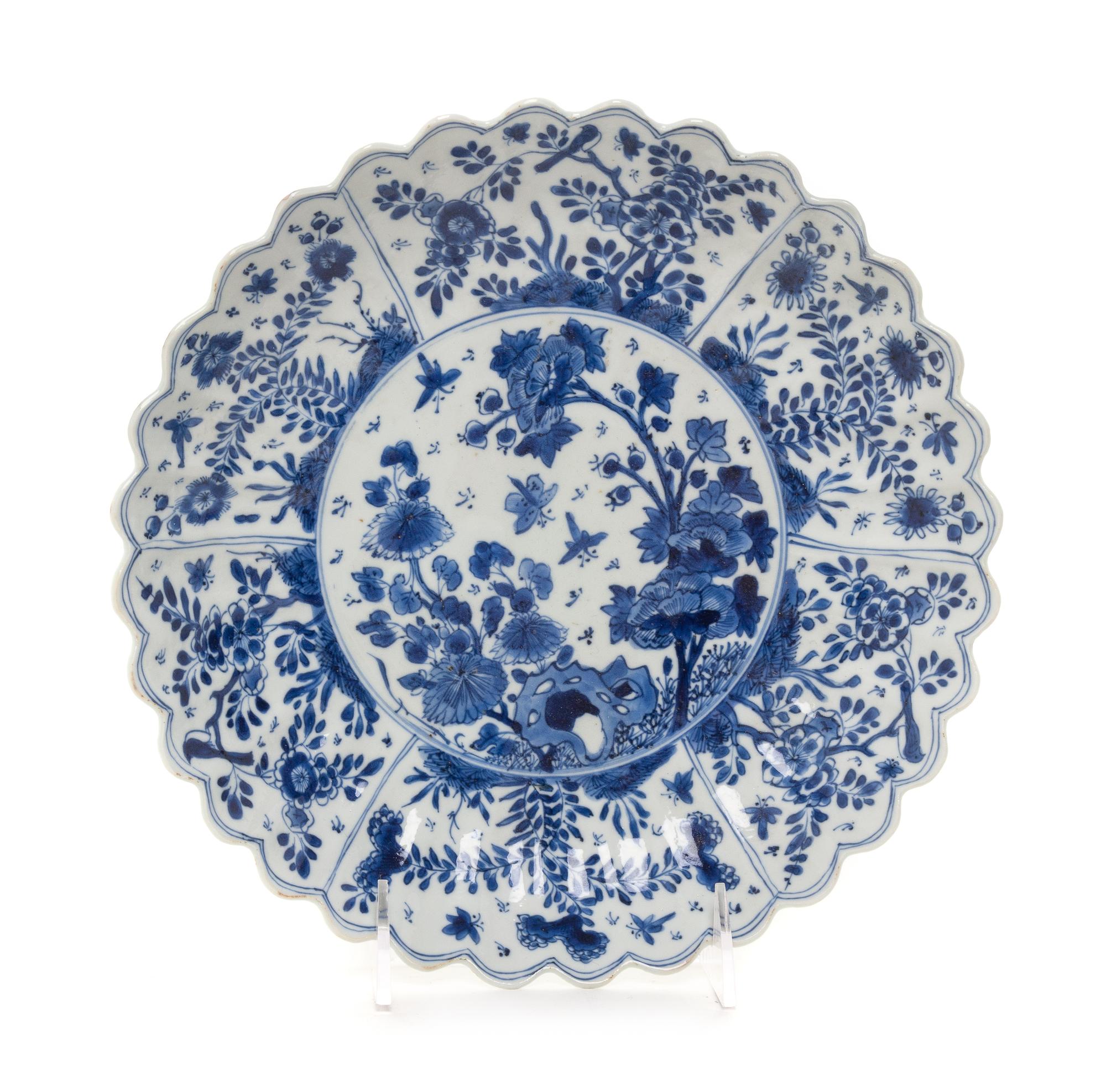 A Chinese Export Blue and White Porcelain Chrysanthemum-Form Dish Diameter 9 1/2 inches. — KANGXI PERIOD (1662-1722)