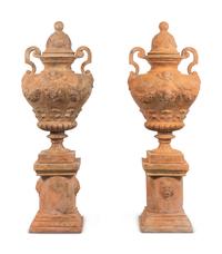 A Large Pair of Neoclassical Terra Cotta Covered Urns on Stands