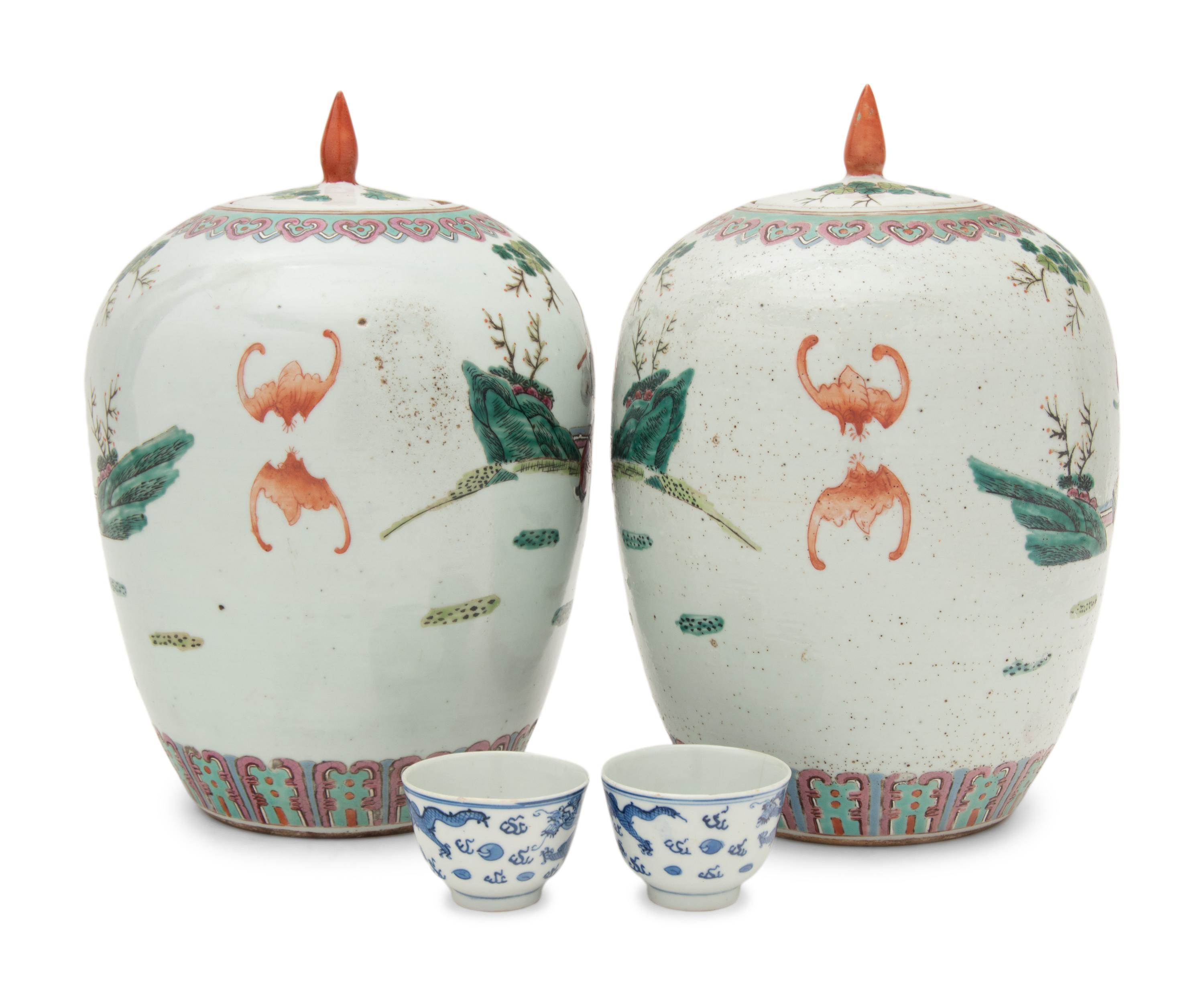 A Pair of Chinese Famille Rose Porcelain Covered Jars and A Pair of Blue and White Porcelain Bowls