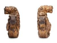 A Pair of Regency Giltwood Lion Mounts