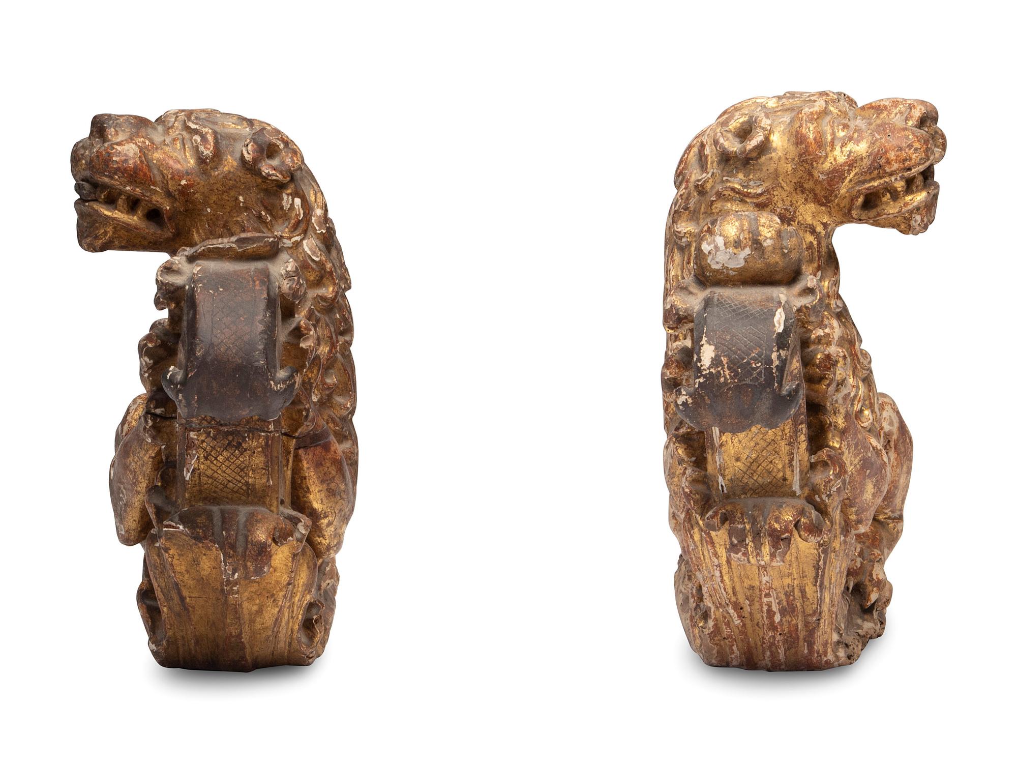 A Pair of Regency Giltwood Lion Mounts