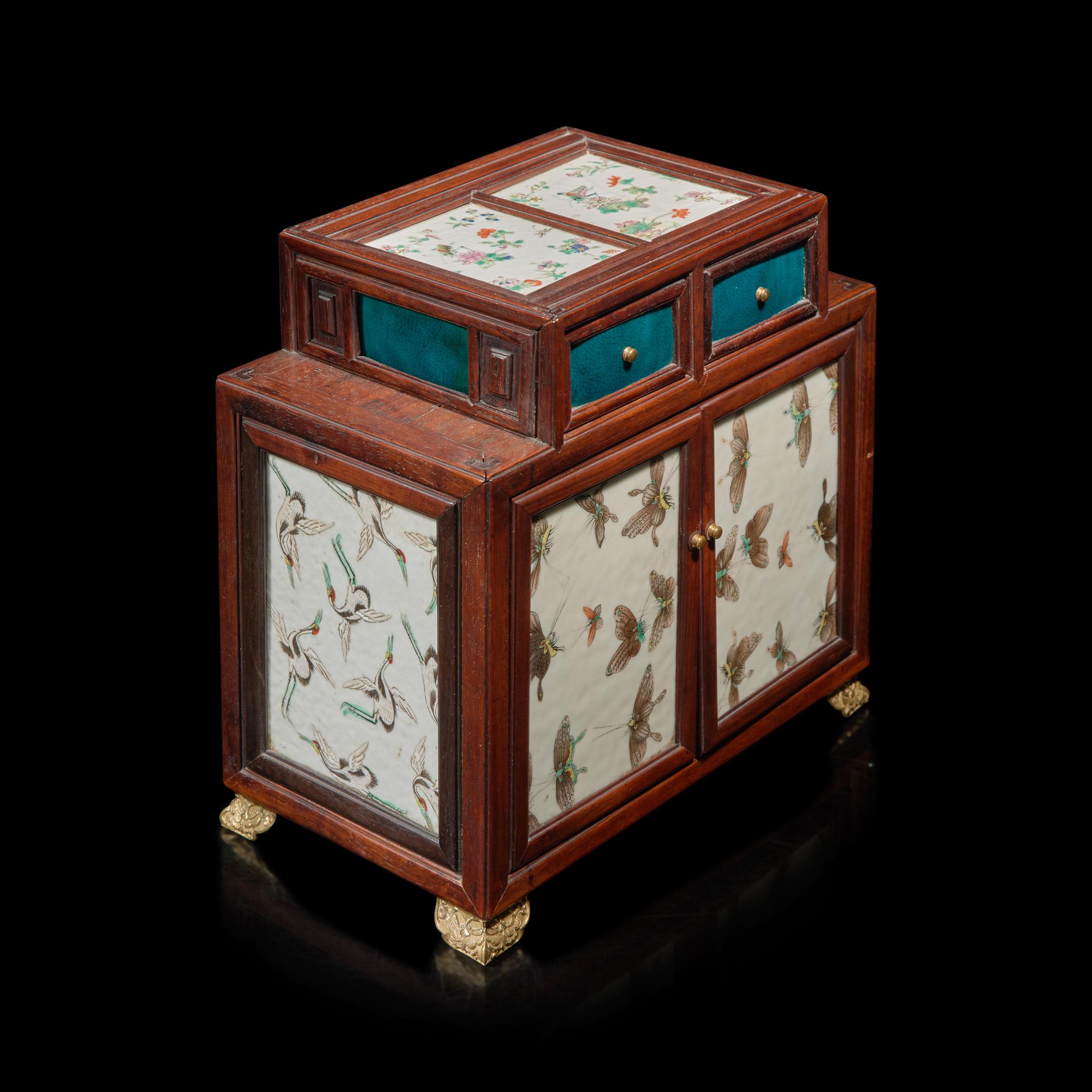 A Small Chinese Porcelain-Inlaid Hardwood Table Cabinet — 硬木嵌粉彩瓷板案頭櫃
