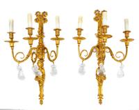 A Pair of Louis XV Style Bronze and Rock Crystal Three-Light Figural Sconces Height 27 1/2 inches. — 20TH CENTURY