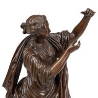 A Pair of French Patinated Bronze Figures