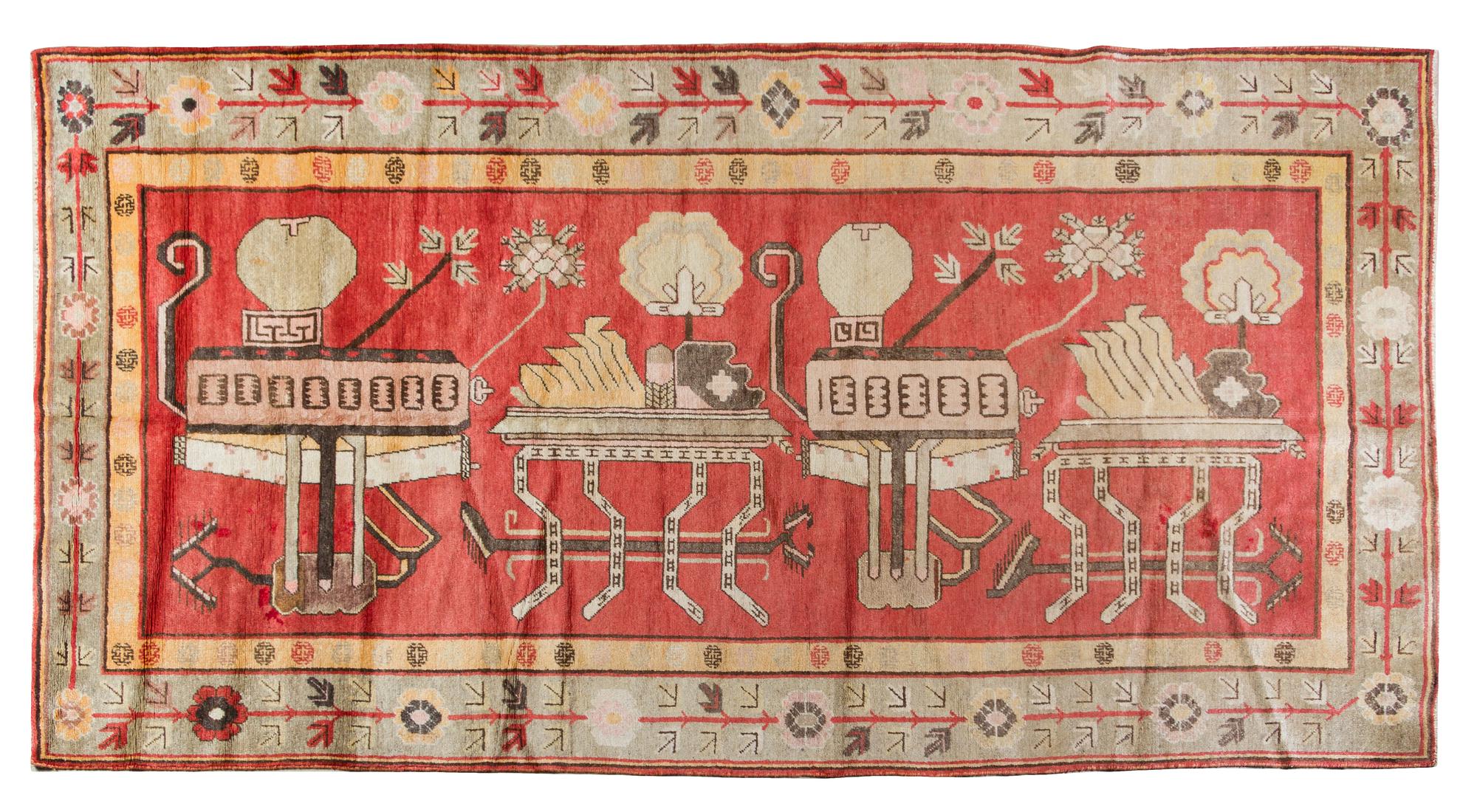 A Khotan Wool Rug 10 feet 7 inches x 5 feet 6 inches.
