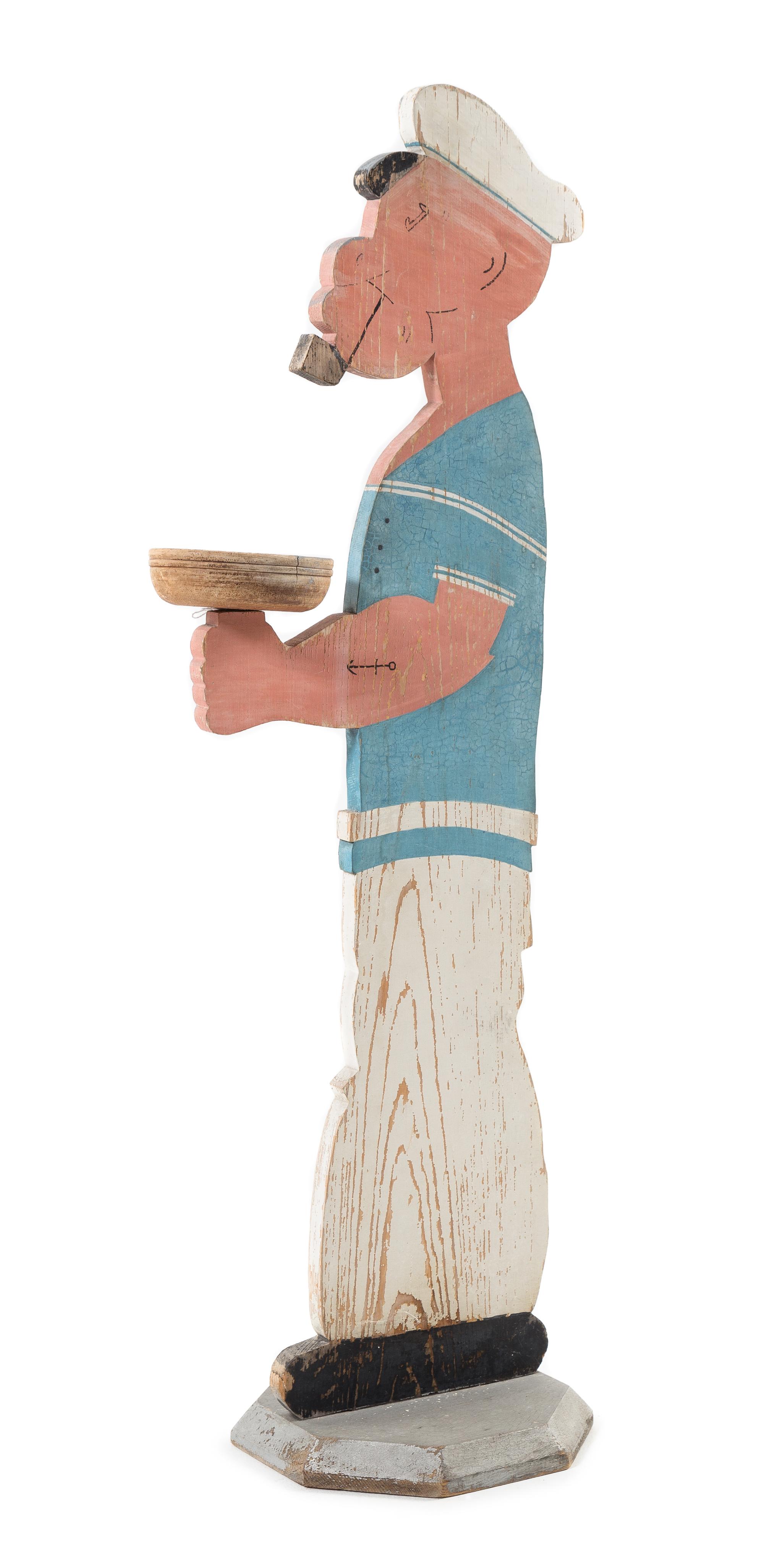 A Standing "Popeye" Tip Tray Height 39 inches. — Mid 20th Century