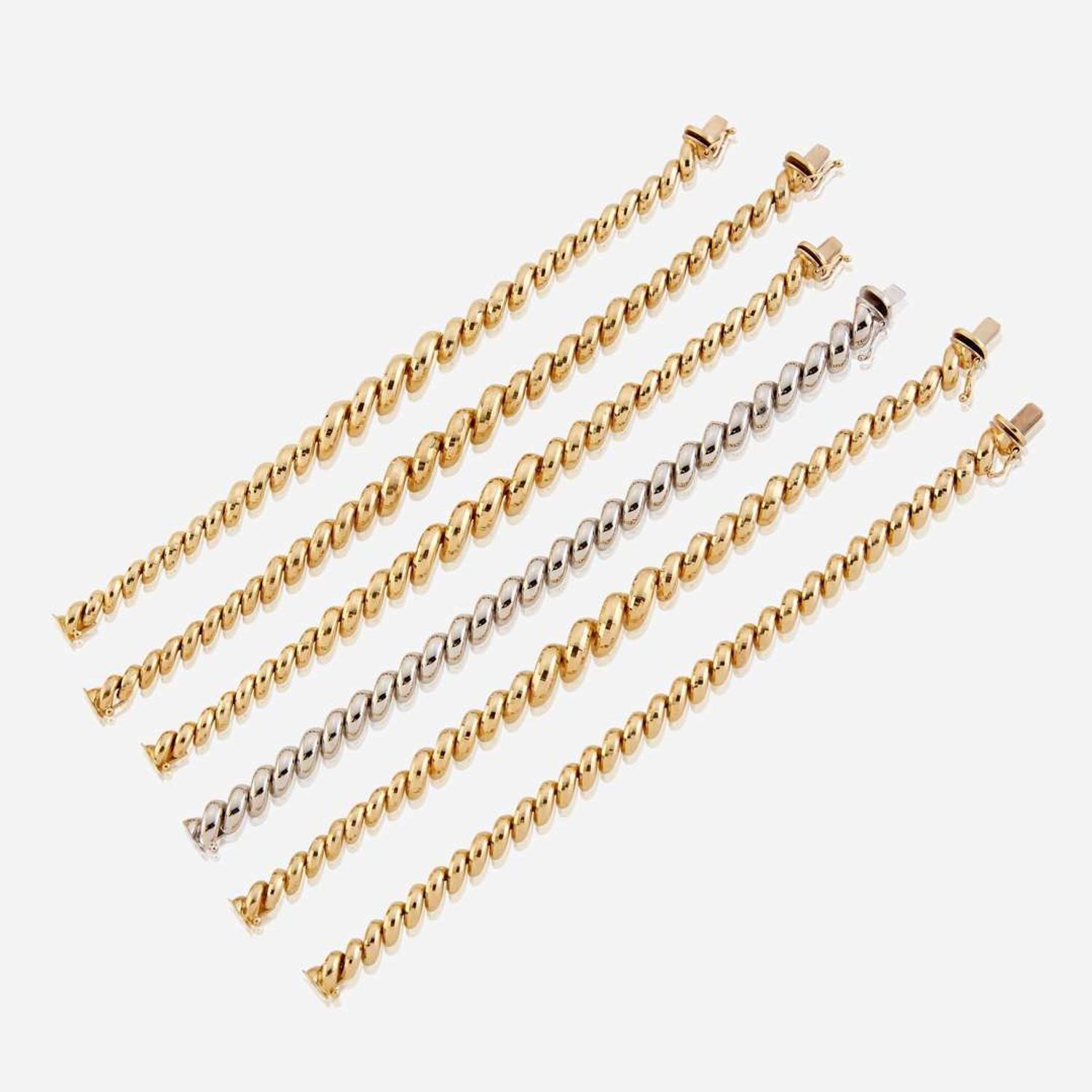 A collection of six fourteen karat gold bracelets