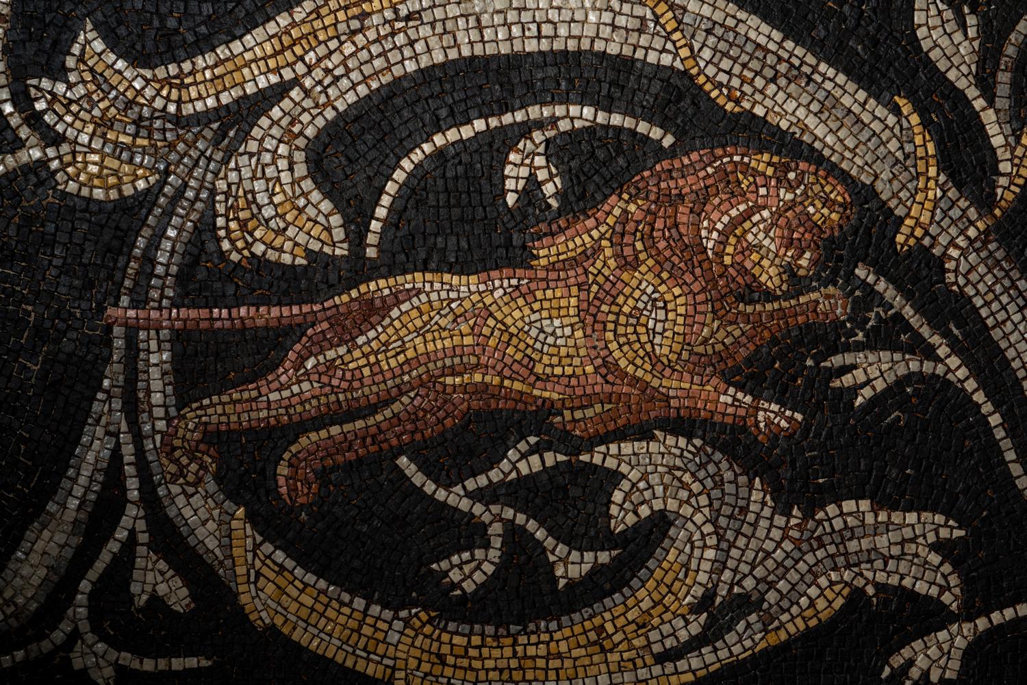 A Roman-Style Polychrome Mosaic Panel with a Bearded Head and Two Animals