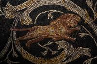 A Roman-Style Polychrome Mosaic Panel with a Bearded Head and Two Animals