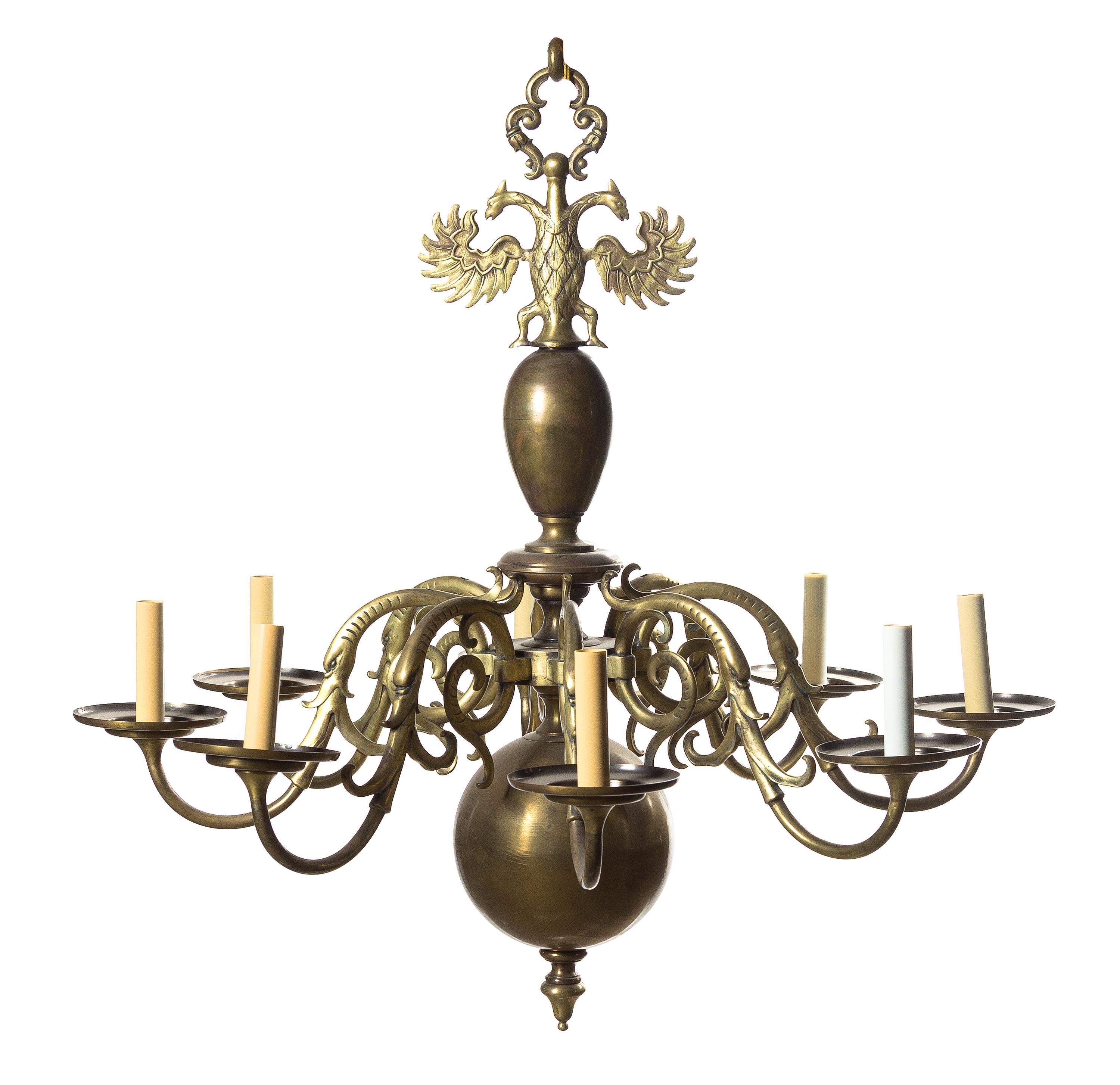 A Dutch Baroque Style Brass Eight-Light Chandelier, Height 30 1/4 x diameter 31 inches.