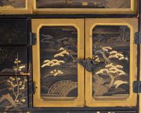 A Japanese Black and Gilt Decorated Table Cabinet, Kodanshu