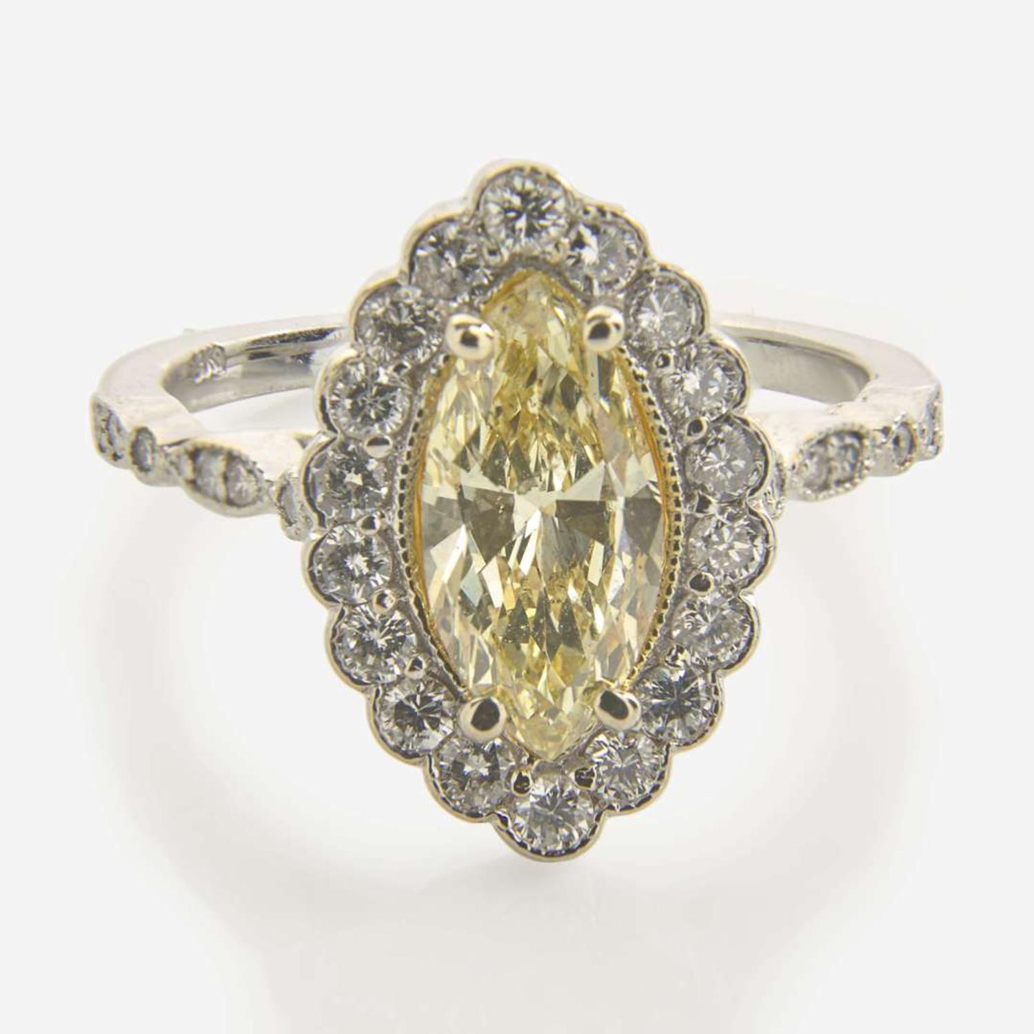 An 18K White Gold, Diamond, and Yellow Diamond Ring 1.31 Carat Fancy Light Yellow Marquise-Cut Diamond, GIA Certified