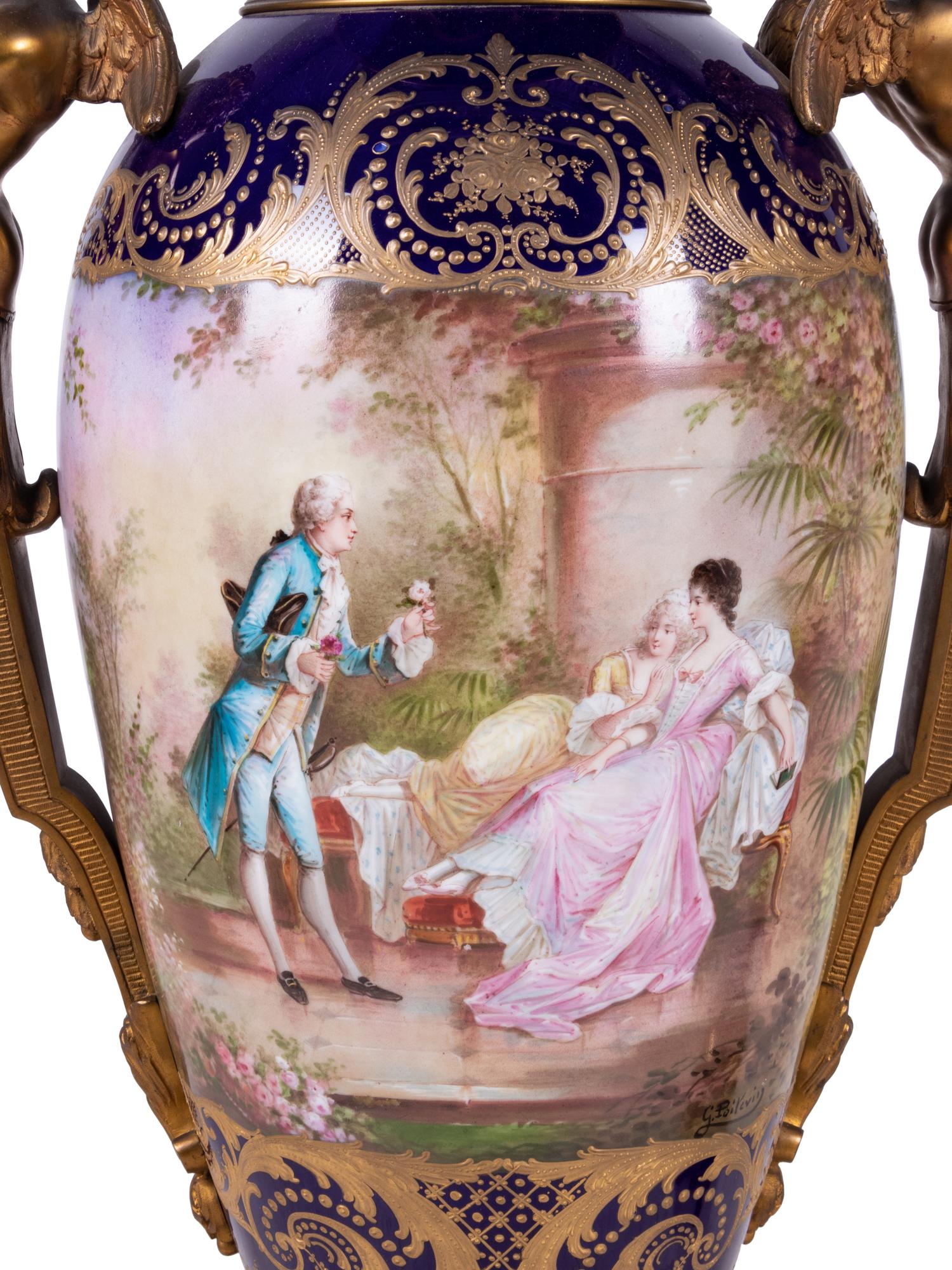 A Pair of Sèvres Style Gilt Bronze Mounted Painted and Parcel Gilt Porcelain Urns