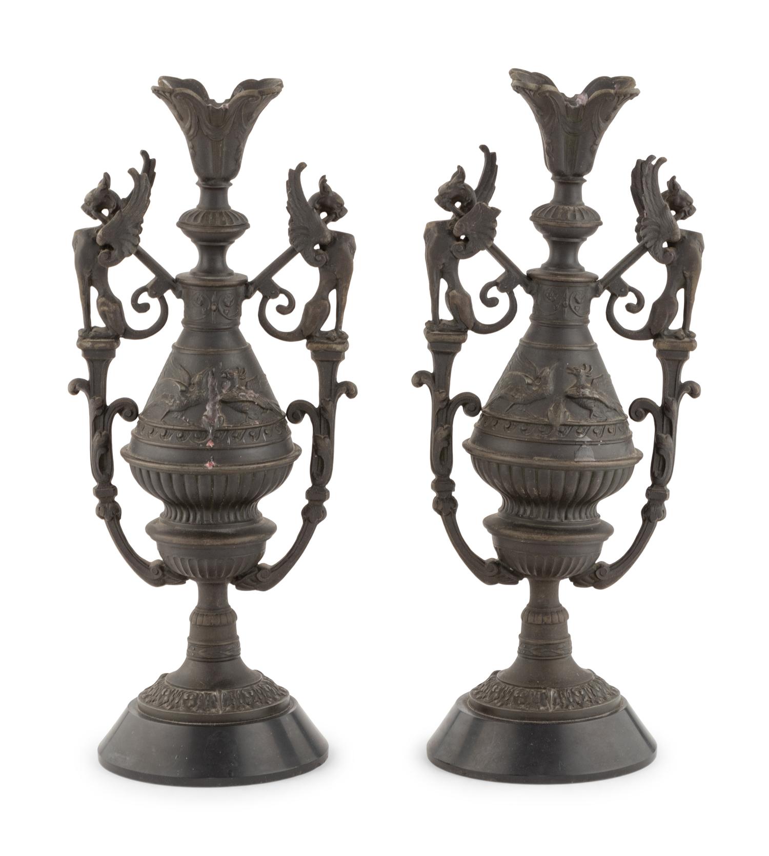 A Pair of Neoclassical Cast Metal Candlesticks