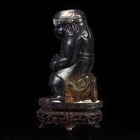 An unusual Chinese dark brown-black jade carving of a Lohan 笑狮罗汉玉雕 Ming dynasty or earlier ????