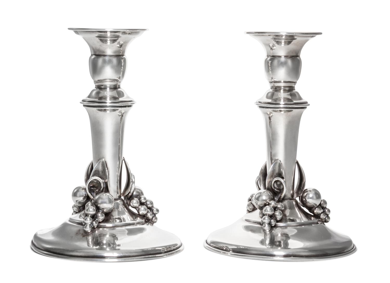 A Pair of Canadian Silver Candlesticks, Carl Poul Petersen, Montreal, 20th Century, each of baluster form with applied decoration.