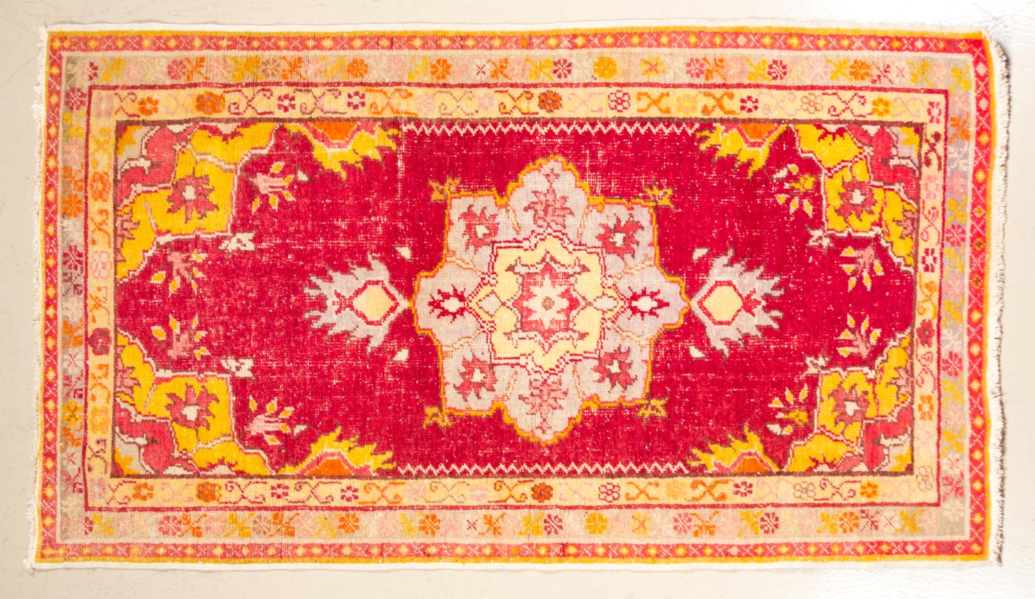 A Persian Wool Mat 5 feet 5 inches x 3 3/4 inches.