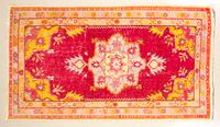 A Persian Wool Mat 5 feet 5 inches x 3 3/4 inches.