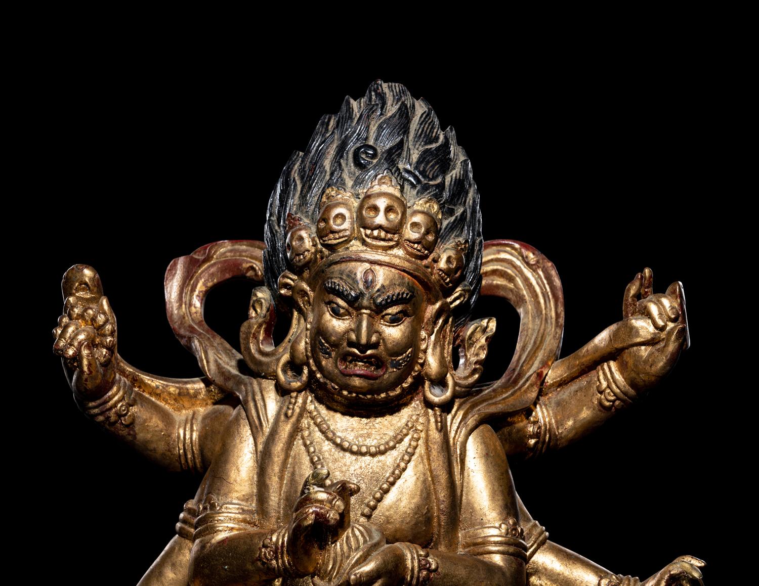 A Large Sino-Tibetan Gilt and Red Lacquered Wood Figure of a Mahākāla