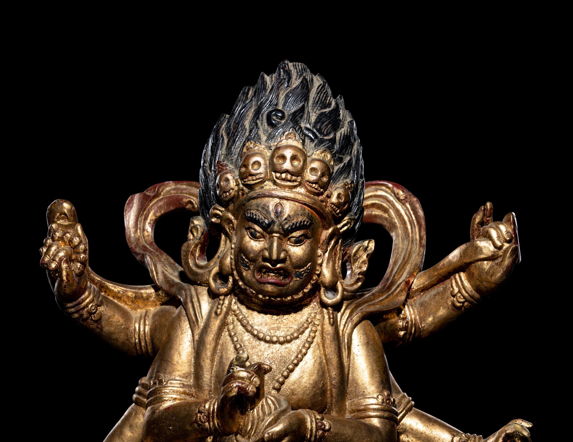 A Large Sino-Tibetan Gilt and Red Lacquered Wood Figure of a Mahākāla