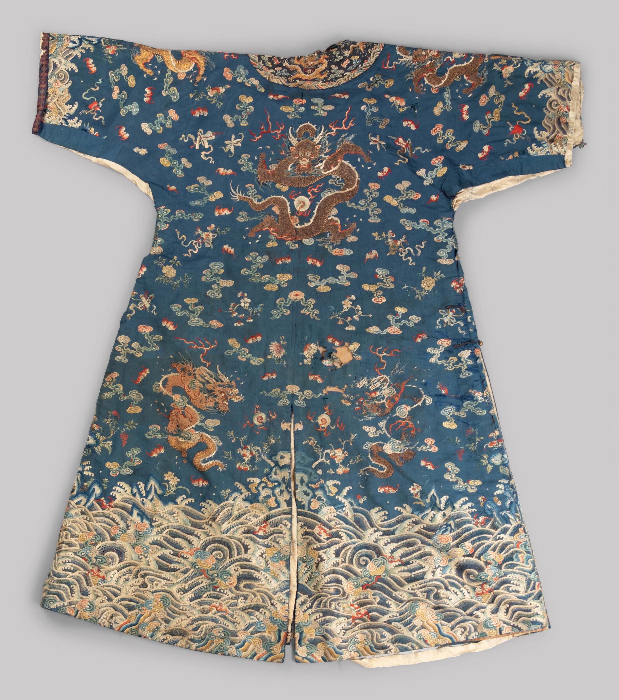 A Chinese Blue Ground Embroidered Silk Dragon Robe, Jifu