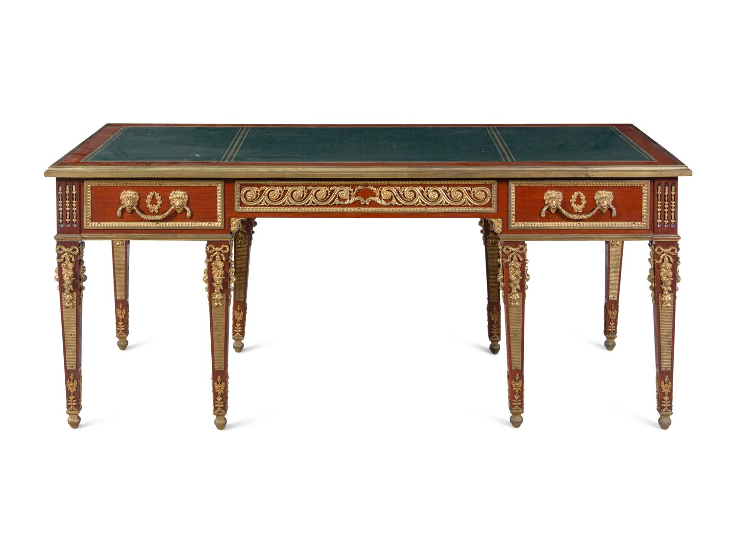 A Louis XVI Style Gilt Bronze Mounted Mahogany Bureau Plat After the Model by Guillaume Benneman