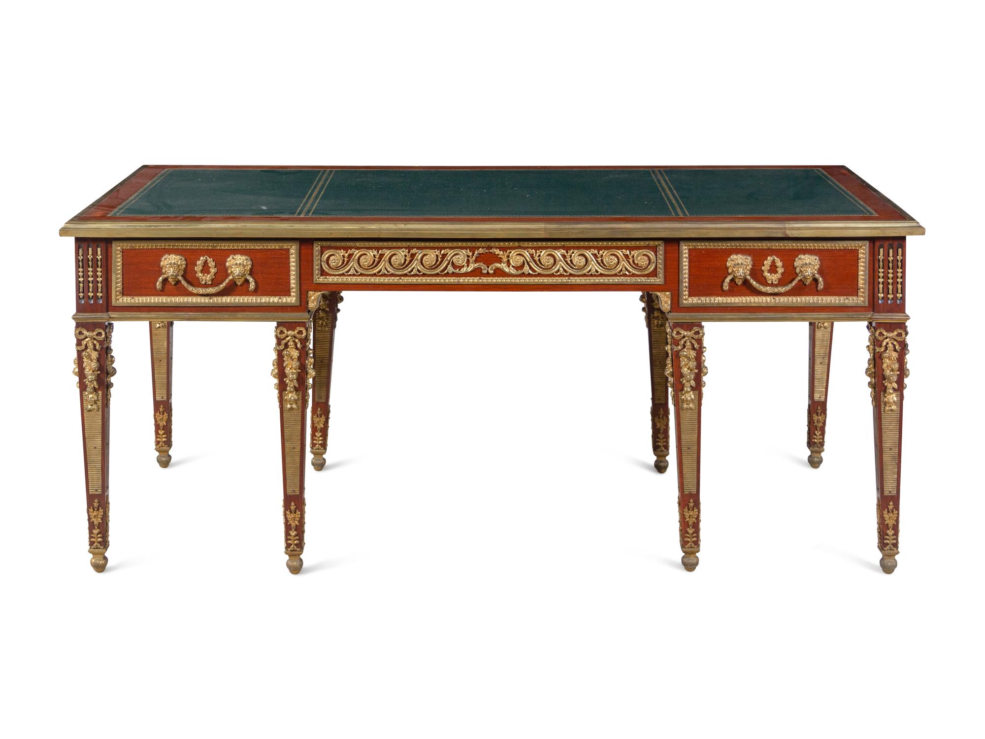 A Louis XVI Style Gilt Bronze Mounted Mahogany Bureau Plat After the Model by Guillaume Benneman