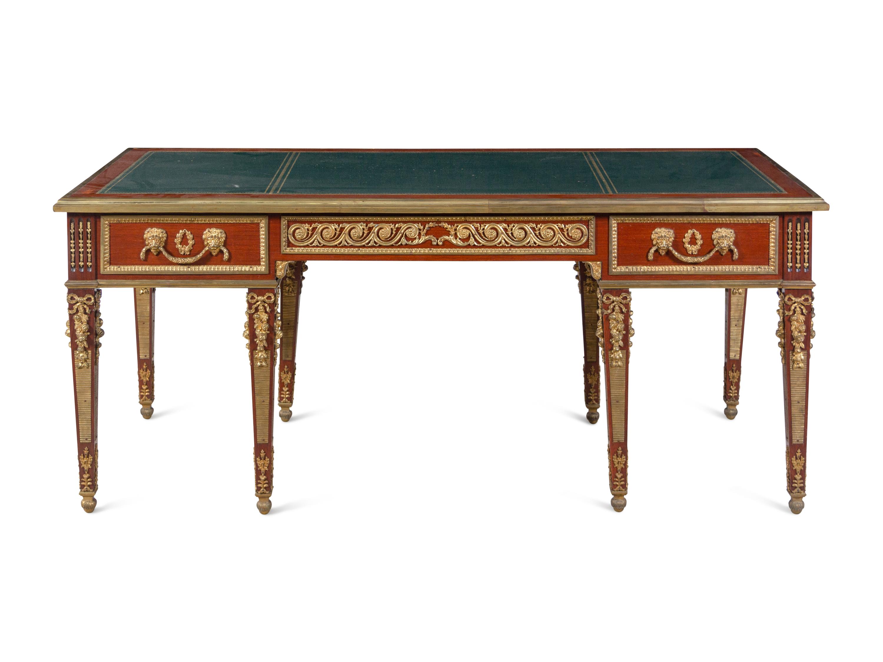 A Louis XVI Style Gilt Bronze Mounted Mahogany Bureau Plat After the Model by Guillaume Benneman