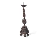 A large Italian Baroque carved walnut pricket candlestick, 16th century
